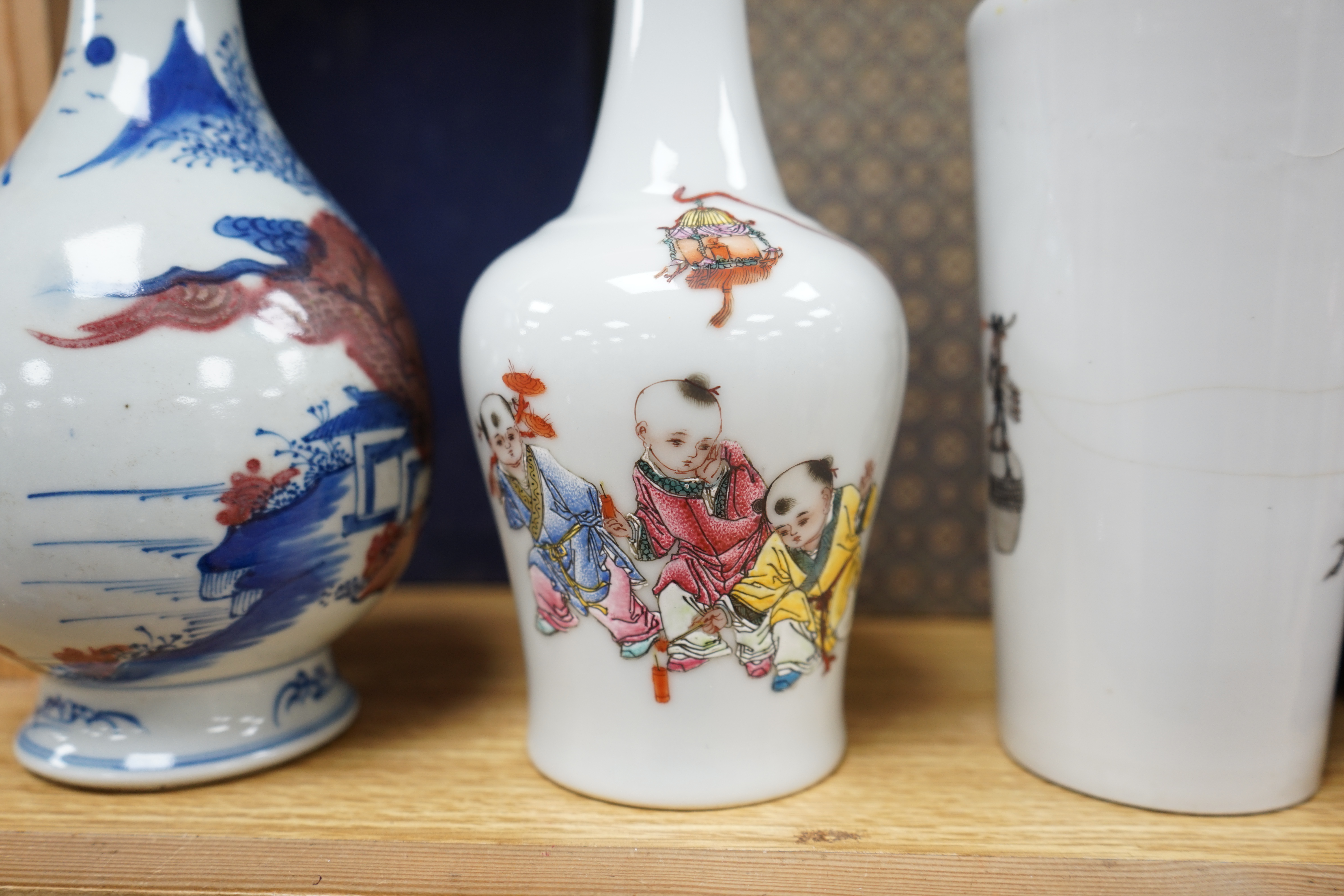 Two Chinese enamelled porcelain figure decorated vases, an underglaze blue and copper read garlic neck vase, and a rectangular jar with wood stand Condition - One vase cracked and chipped the rectangular jar lacking cove